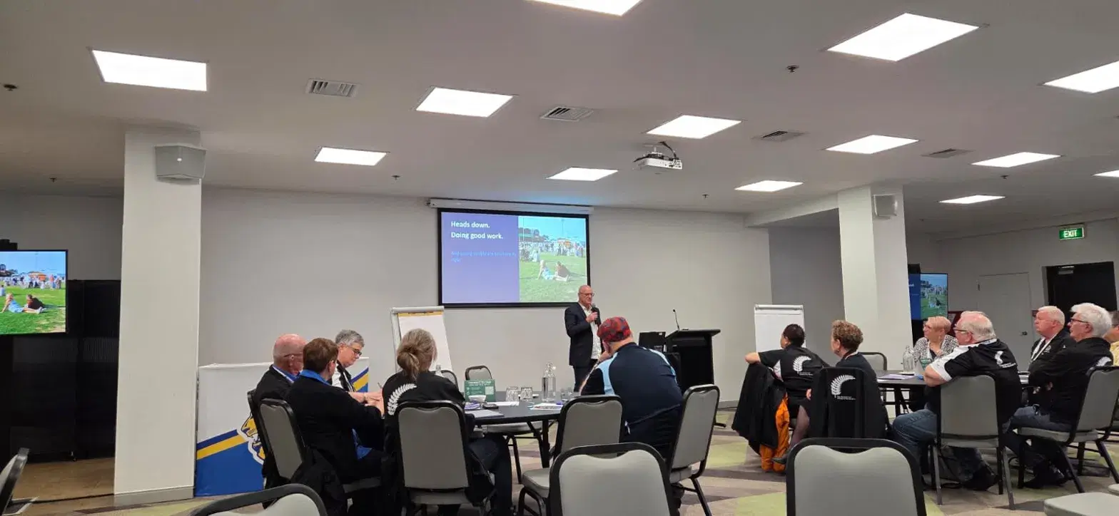 Andy speaking to a room at a Lions Club conference
